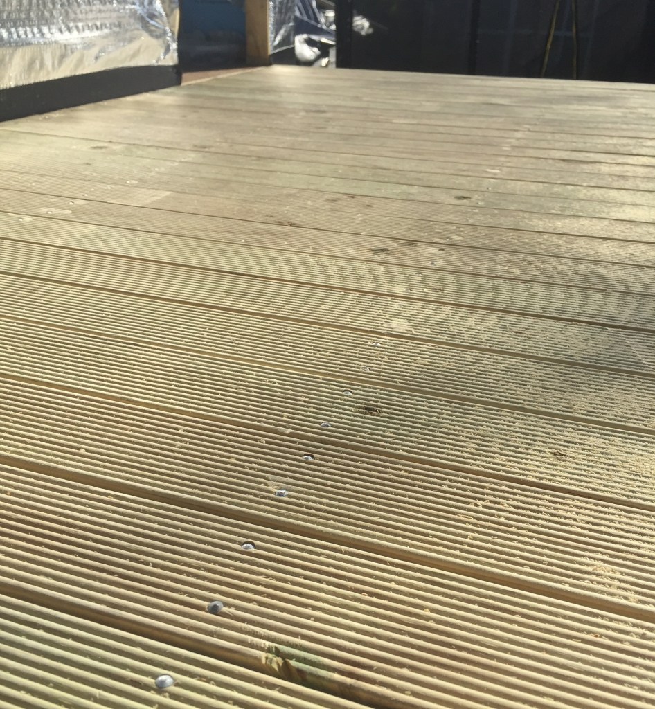 Laying decking on the verandah