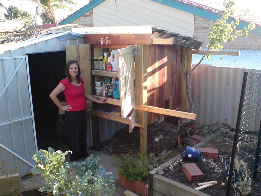 Wife standing with open storage doors